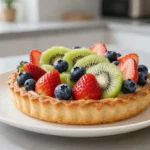 Délicieuse tarte aux fruits de saison cuite au Airfryer, parfaite pour un dessert léger.